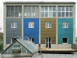Südansicht des sanierten Kohlesilos in Basel mit der vierfarbigen, vollflächig integrierten Photovoltaik-Fassade aus monokristallinen Zellen (zvg)